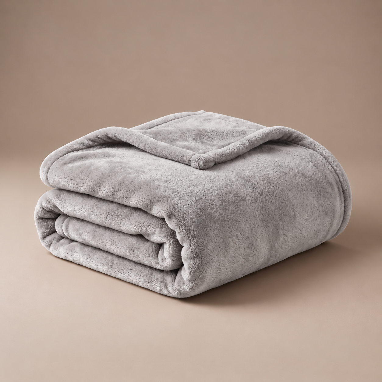 Close-up of soft gray plush blanket texture